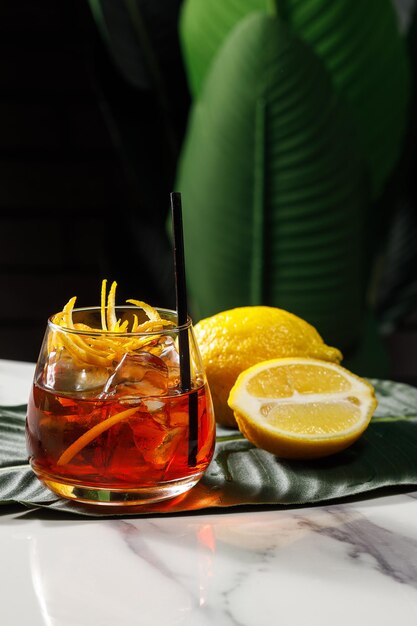 Glass of iced alcohol cocktail in bar