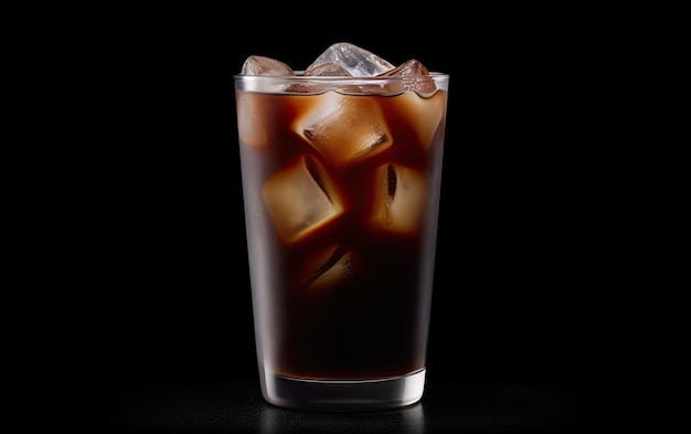 A glass of iced coffee with ice cubes on a black background.
