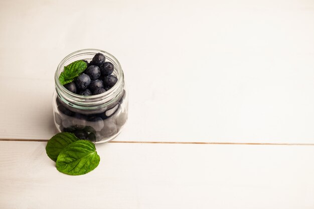 Glass jar of fresh blueberries