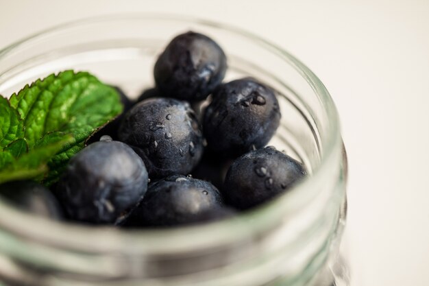 Glass jar of fresh blueberries