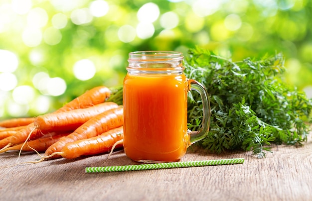 Glass jar of fresh carrot juice