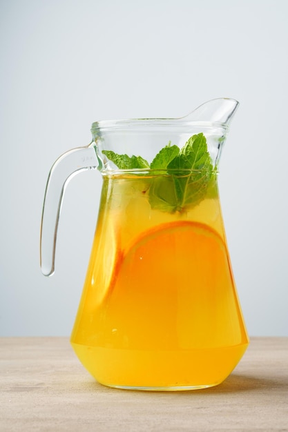 Glass jar of fresh lemonade on table close up