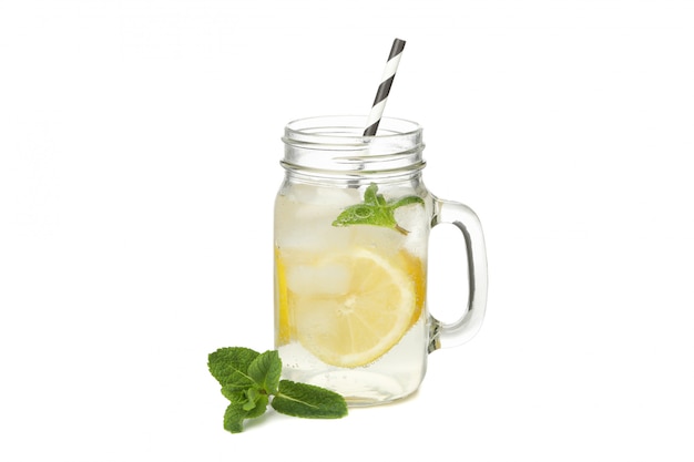 Glass jar of lemonade isolated on white surface