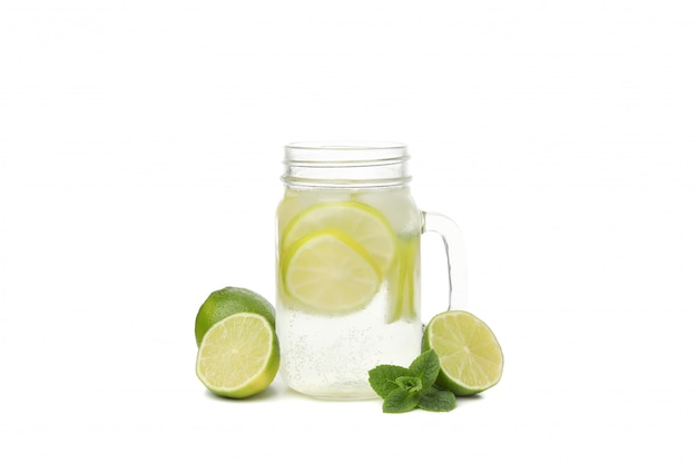 Glass jar of lemonade isolated on white surface