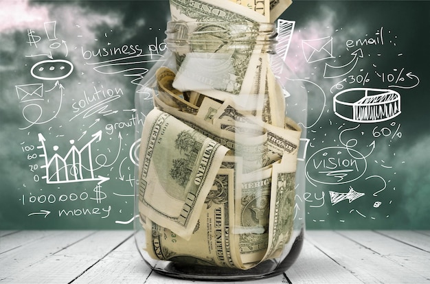 glass jar for money  on background