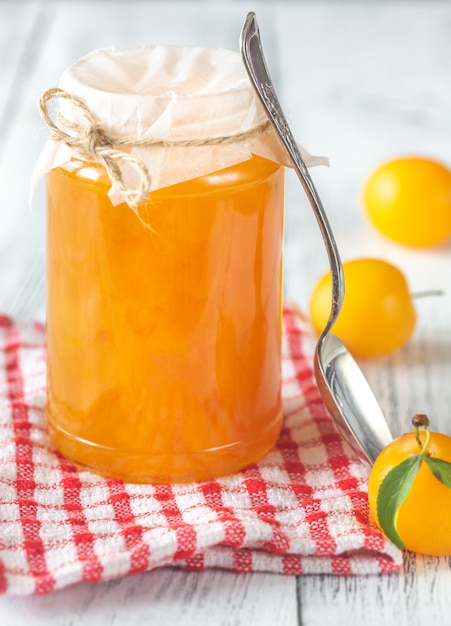 Glass jar of plum jam