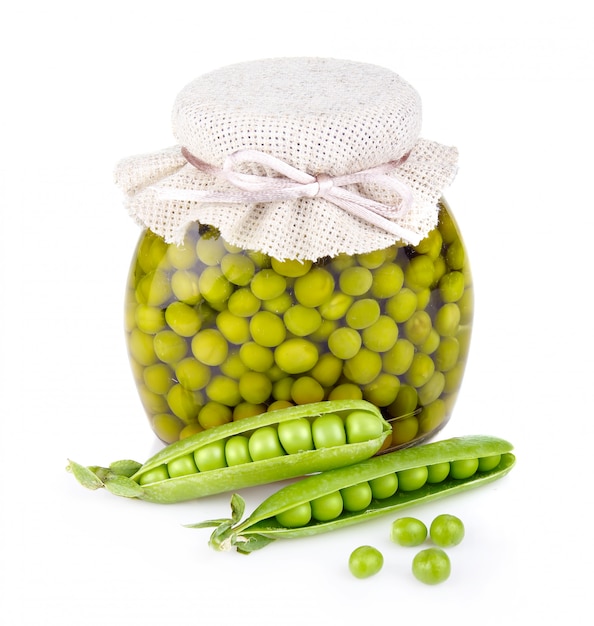 Glass jar of preserved peas and pods isolated on white
