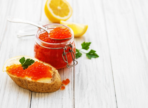 Glass jar of red caviar