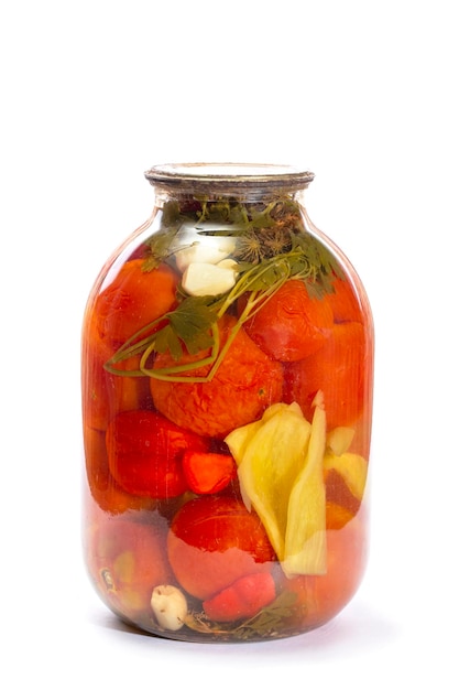 Glass jar with canned tomatoes on a white background