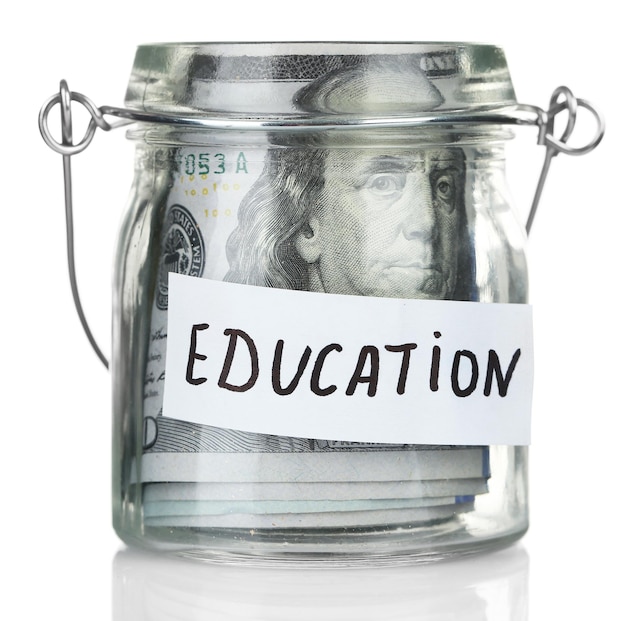 glass jar with dollar banknotes for education isolated on white