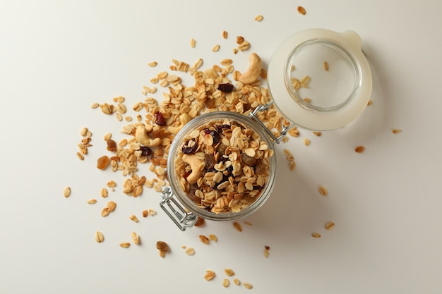 Glass jar with granola, nuts and raisins