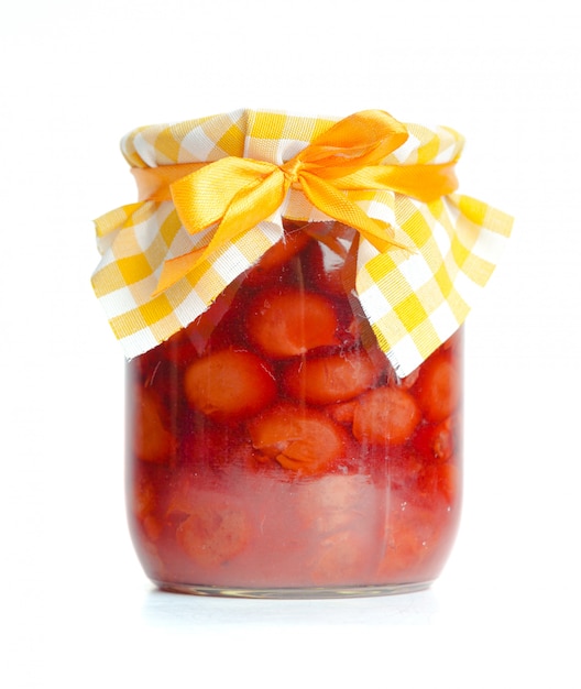 Glass jar with  jam isolated on the white background