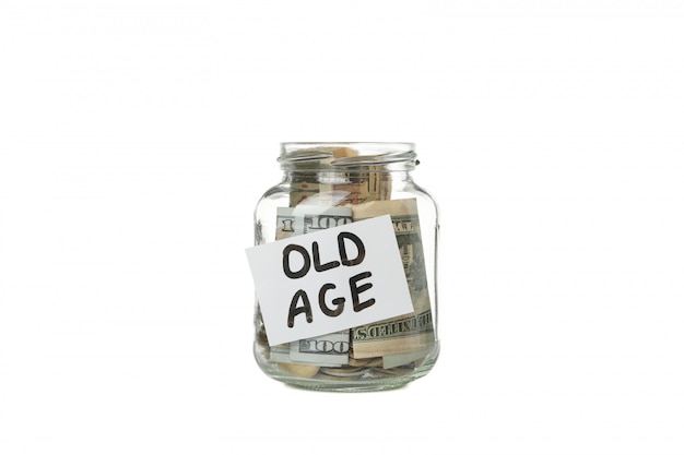 Glass jar with money and inscription Old age isolated on white surface