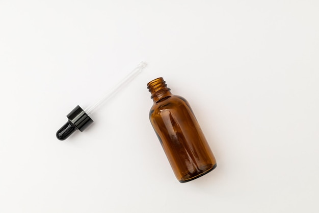 Photo glass jar with pipette filled with liquid