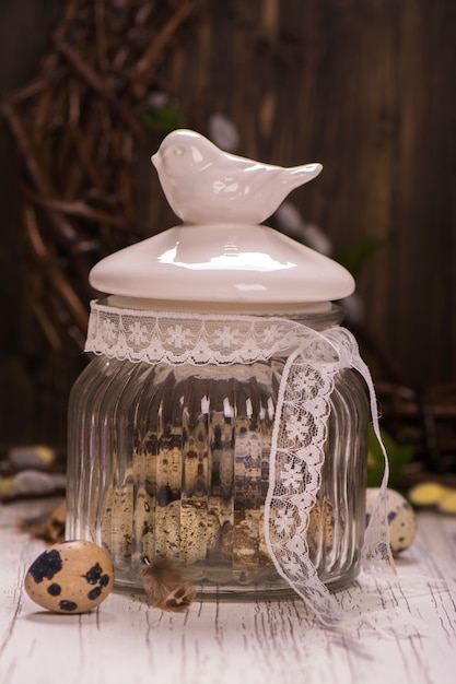 Glass jar with quail eggs