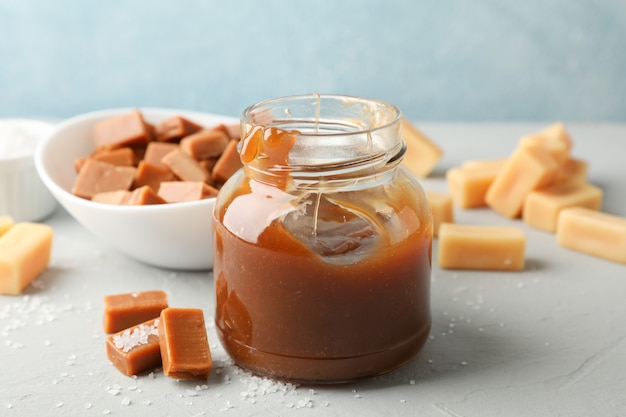 Glass jar with salted caramel and candies space for text