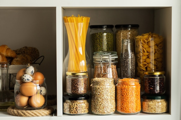 Photo glass jars with food. food concept. shelves in the kitchen. products on the shelves.