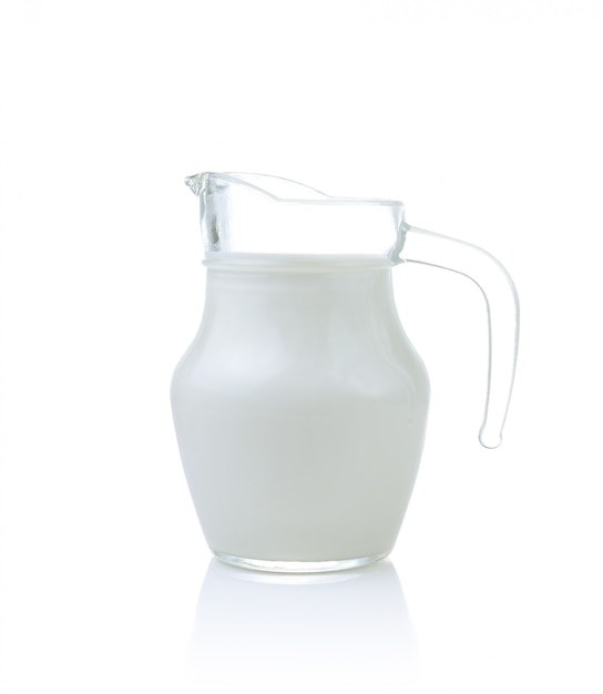 Glass jug of fresh milk isolated on white