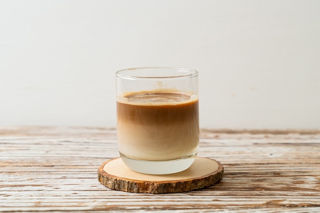 glass of latte coffee, coffee with milk on wooden table