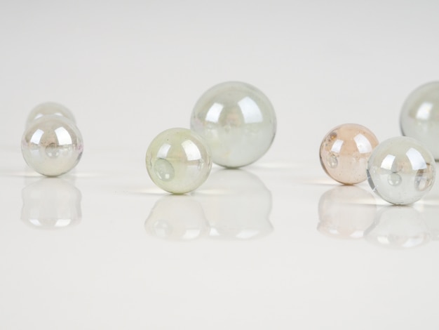 Glass marbles on a white surface