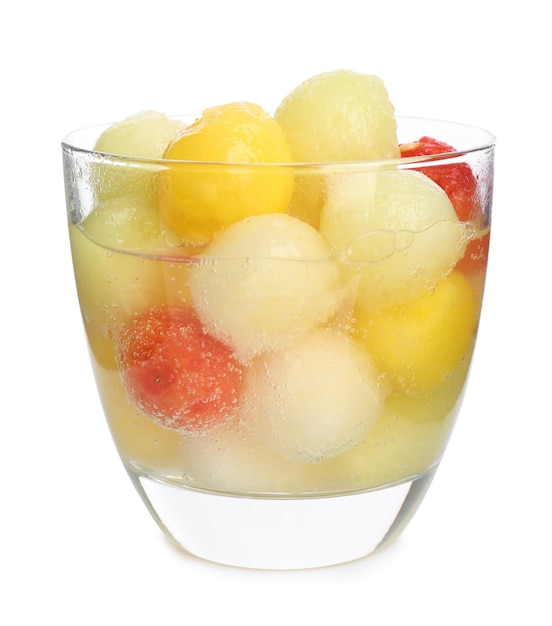Glass of melon and watermelon ball cocktail on white background
