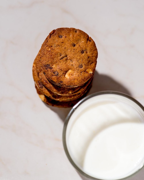 Glass of milk and biscuits Top view