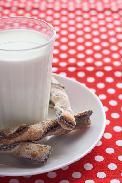 A glass of milk and cookies for a snack