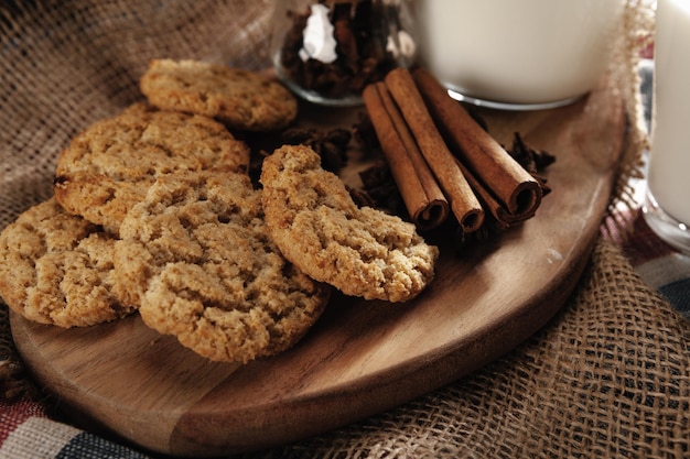 Glass of milk and cookies on table