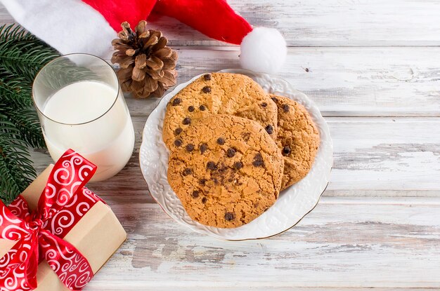 Glass of milk and cookies with chocolate for Santa