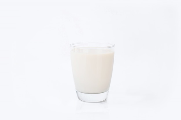 Glass of milk isolated on white wall, healthy drinking and calcium beverage of cow