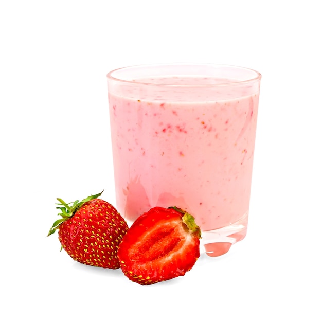 The glass of milk shake, one whole and half of strawberries isolated  