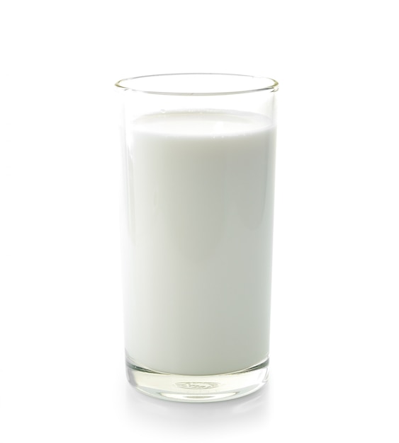 Glass of milk on white wall