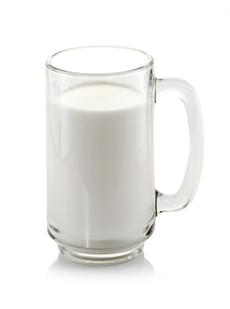 Glass of milk on white wall