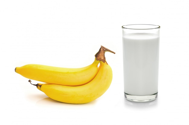 Glass of milk  with  banana over white space