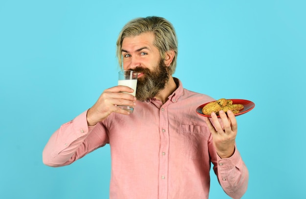 Glass of milk with cookies for santa claus on christmas eve happy farmer eat biscuit bearded man drink useful milk with pastry Lucky in Love Classic Milk and Cookies Fresh healthy milk