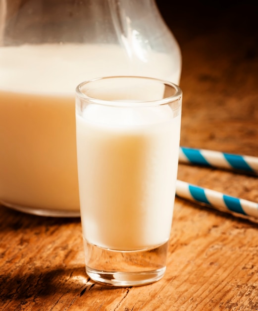 glass of milk on wooden table