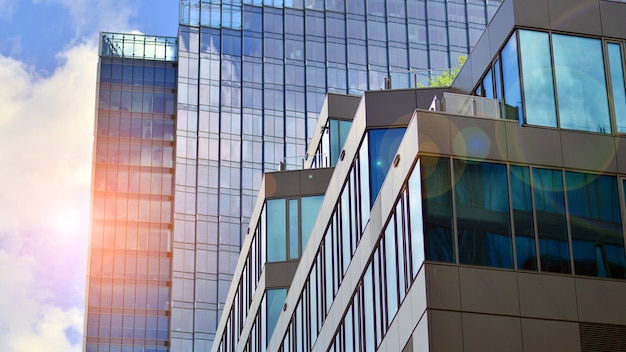 Glass modern building with blue sky background View and architecture details Urban abstract