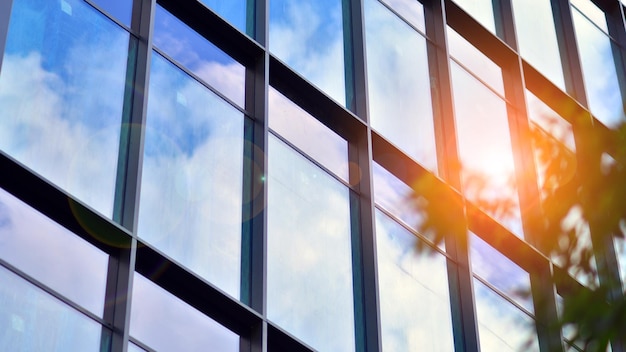 Glass modern building with blue sky background View and architecture details Urban abstract