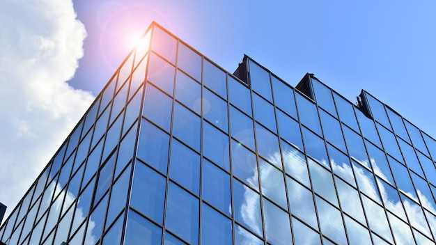 Glass modern building with blue sky background View and architecture details Urban abstract