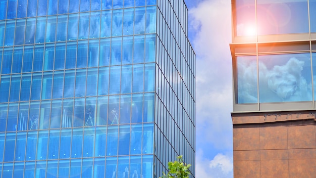 Glass modern building with blue sky background View and architecture details Urban abstract