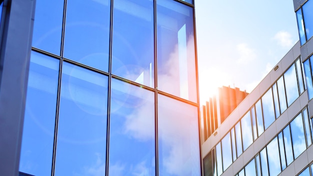 Glass modern building with blue sky background View and architecture details Urban abstract