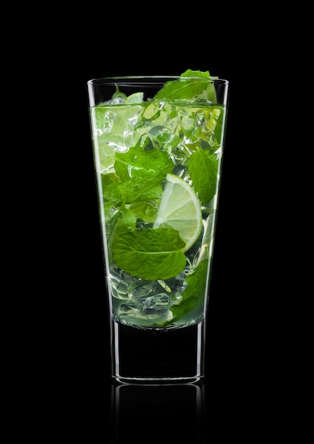 Glass of mojito cocktail glass with ice cubes, mint and lime isolated on white background