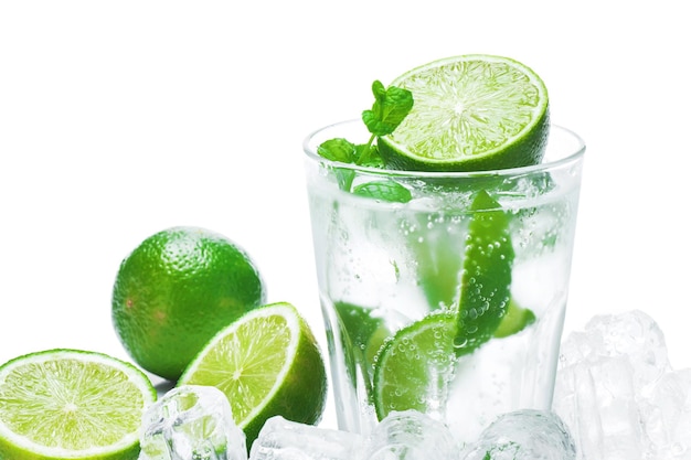 Glass of Mojito highball cocktail or refreshing drink with lime and mint on white background