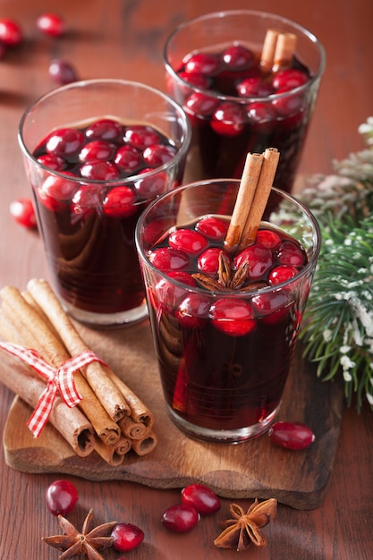 Glass of mulled wine with cranberry and spices, winter drink