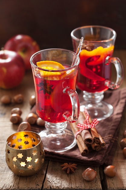 Glass of mulled wine with orange and spices