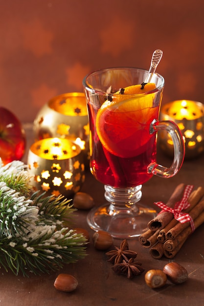 Glass of mulled wine with orange and spices