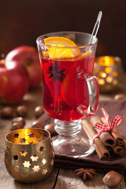 Glass of mulled wine with orange and spices