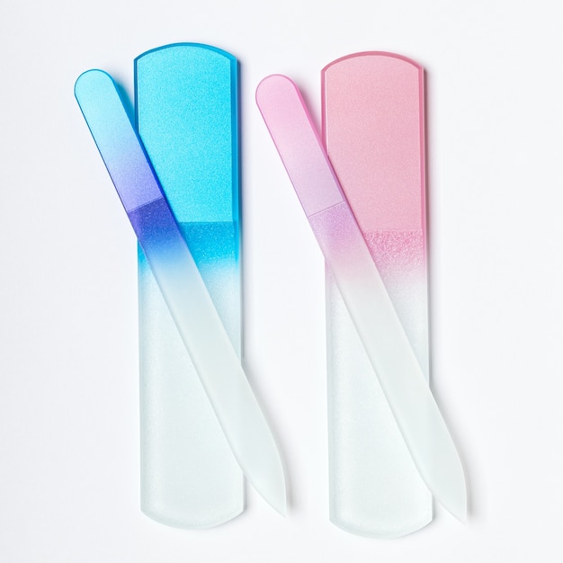 Glass nail files on white background