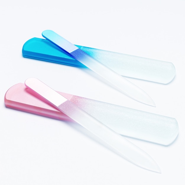 Glass nail files on white background