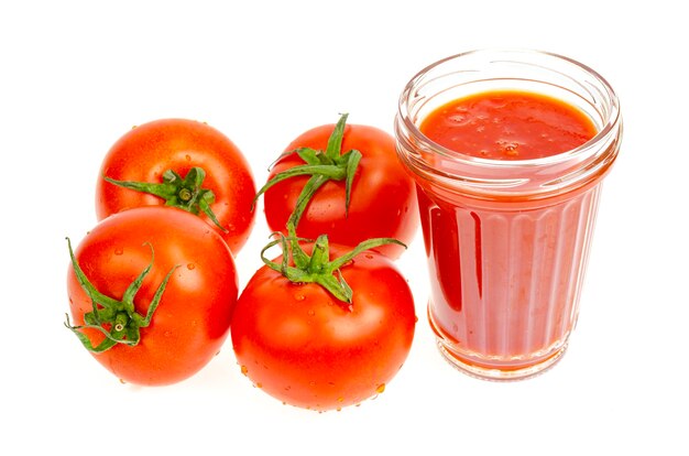 Glass of natural tomato juice fresh red tomatoes